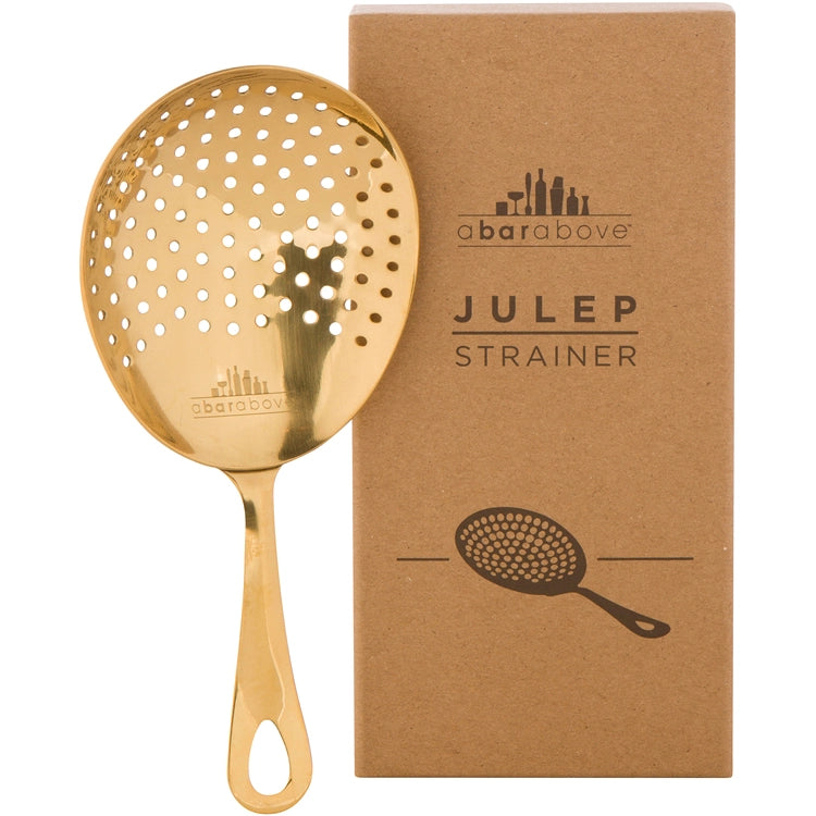 Gold julep strainer with packaging on a white background