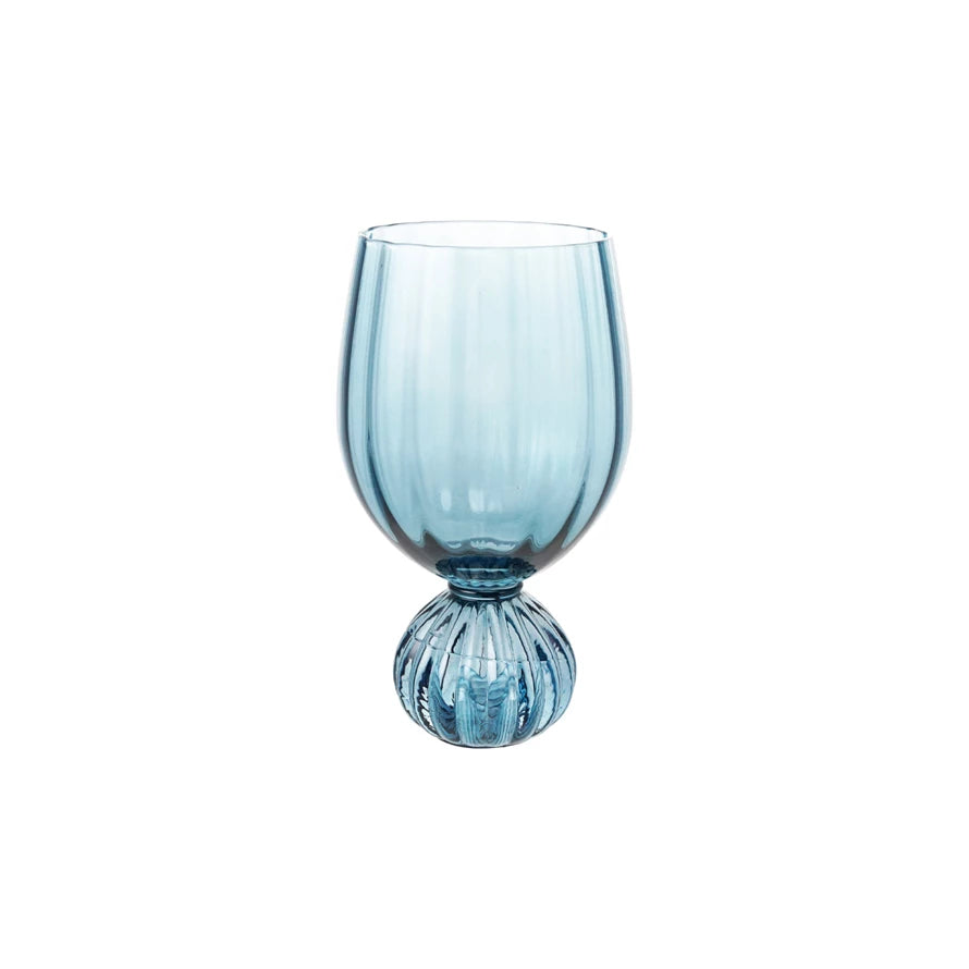 Blue glass wine glass on a white background