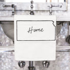 Decorative wall with metallic fixtures and a sign reading 'Home'.